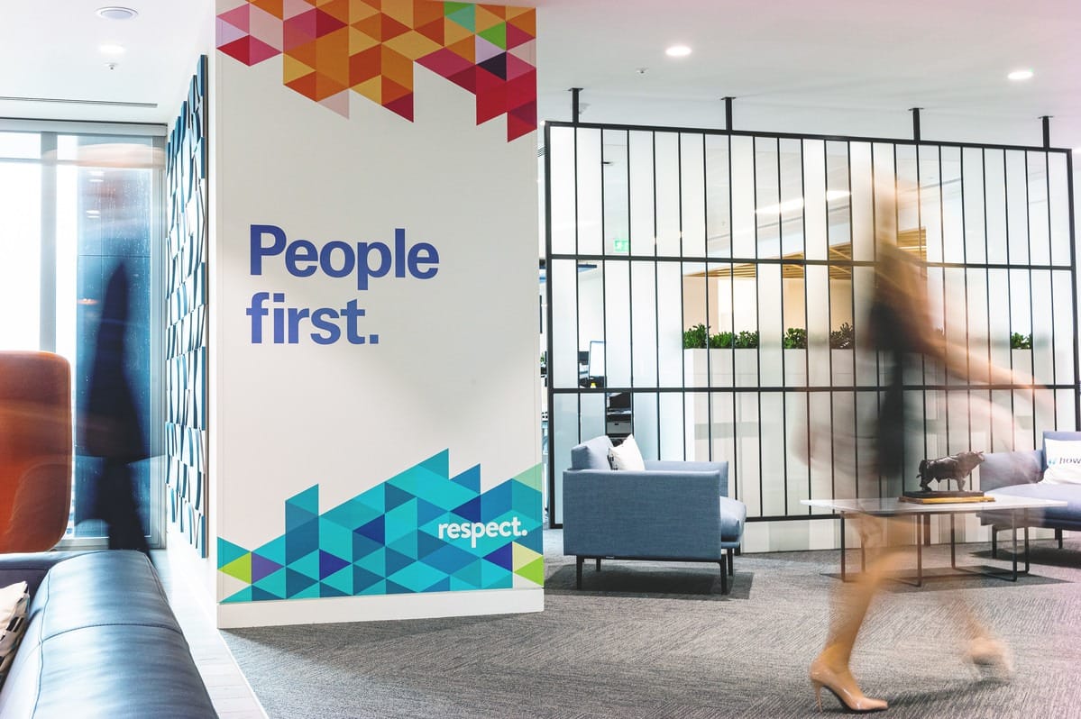 Lady walking past people first poster